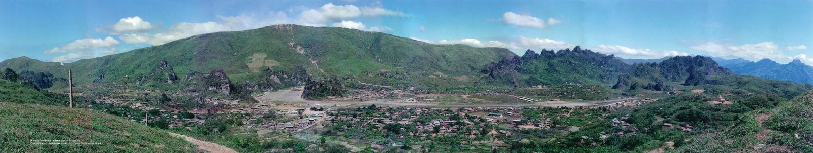 Panoramic view of the Long Cheng valley, surrounding mountains, and airstrip.